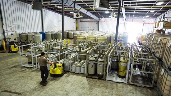Nalco Water DI tanks in water plant warehouse.